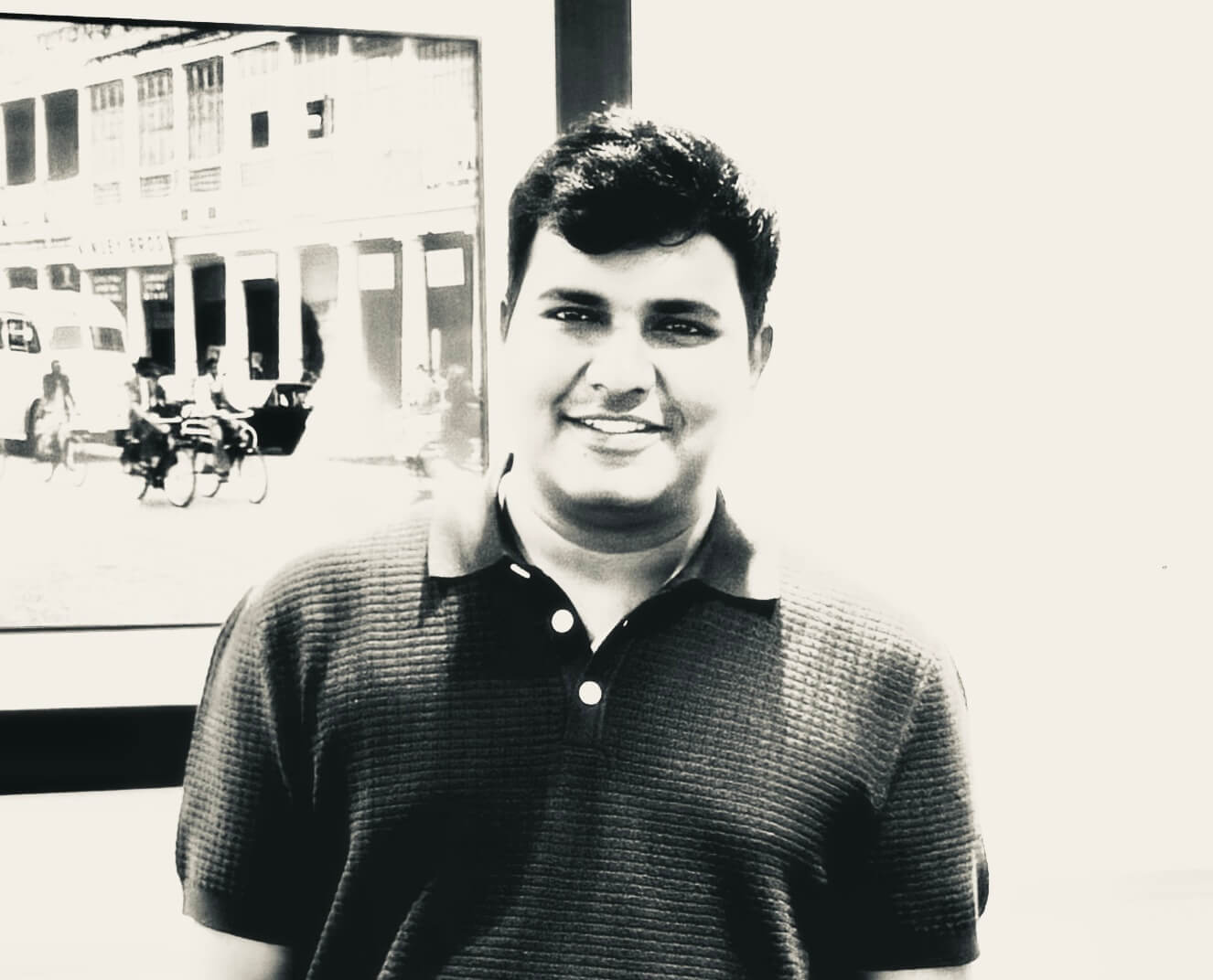 A black and white portrait of Visrey